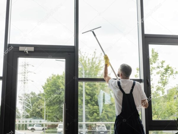 back view man overalls washing